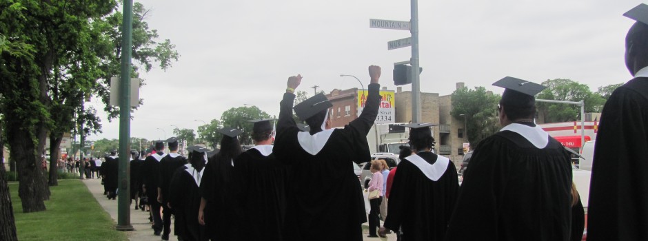 Students celebrating their great accomplishment as they walk over to Holy Trinity Church for convocation. 053